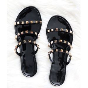 Black studded jelly sandals